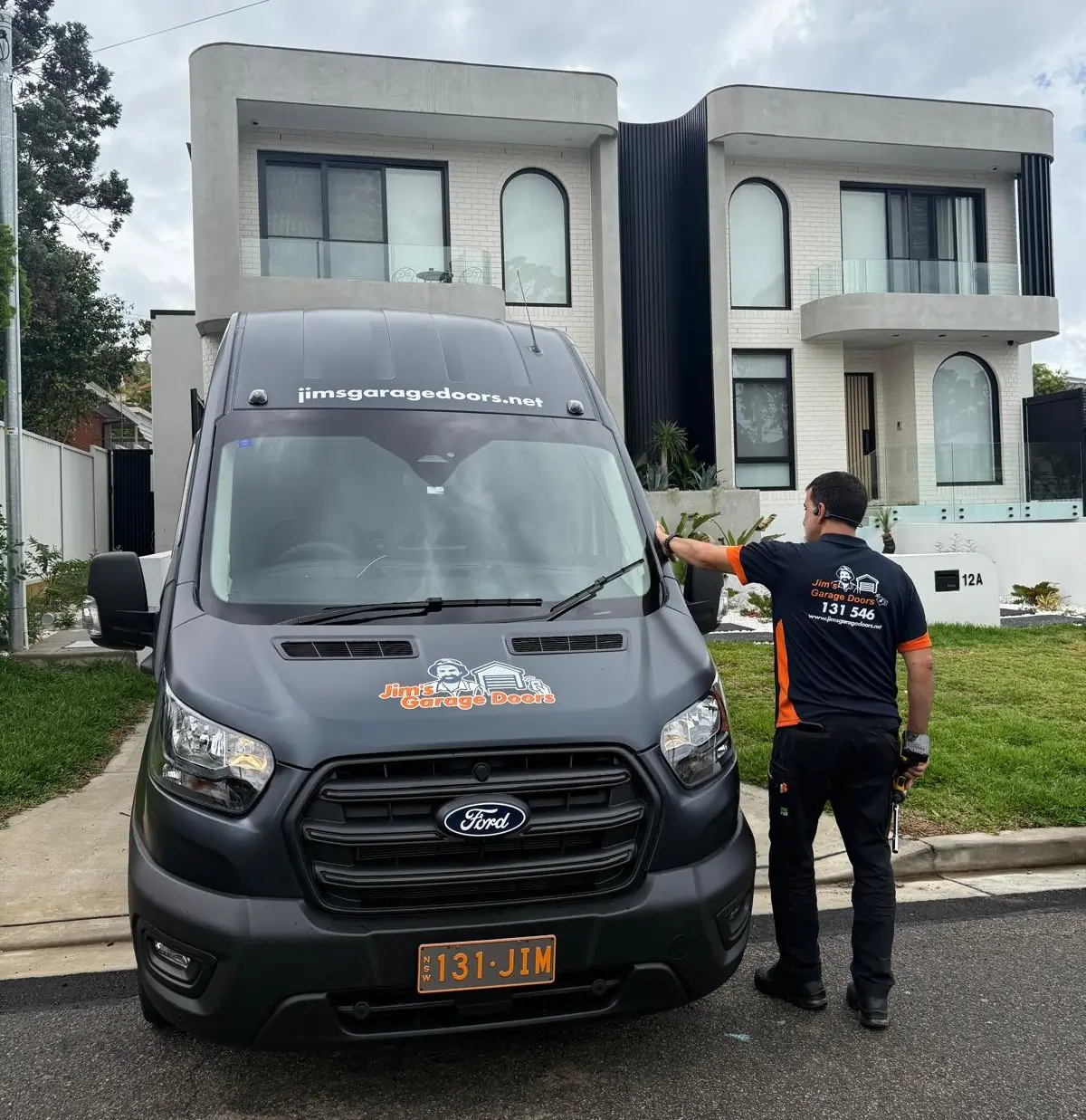 Jims Garage Doors Technician Arriving Residential Service Van