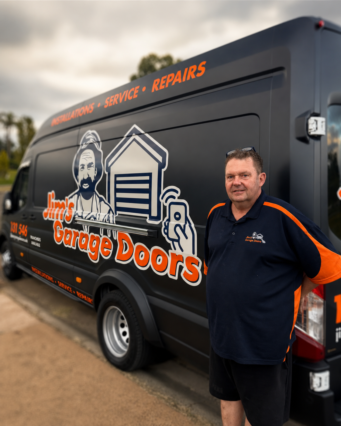 Garage door repairs technician with service van