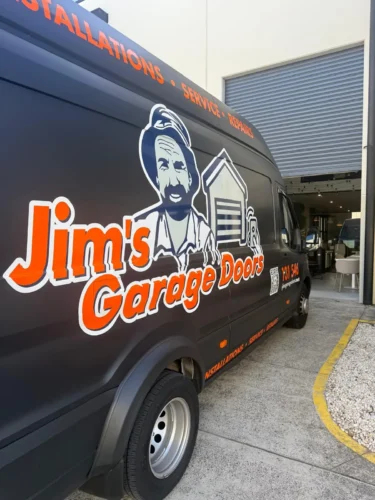 Jim’s Garage Doors service van on site at property for garage door repair and installation services
